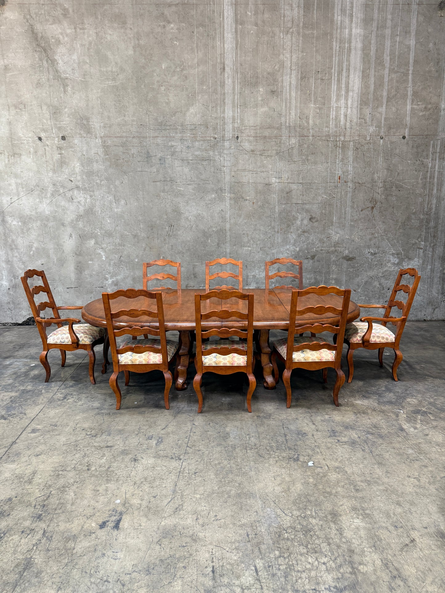 Custom Early Spanish Style Walnut Dining Table – Round to Oval with Leaves, Carved Stretcher Base, 107″L × 60″W × 30″H