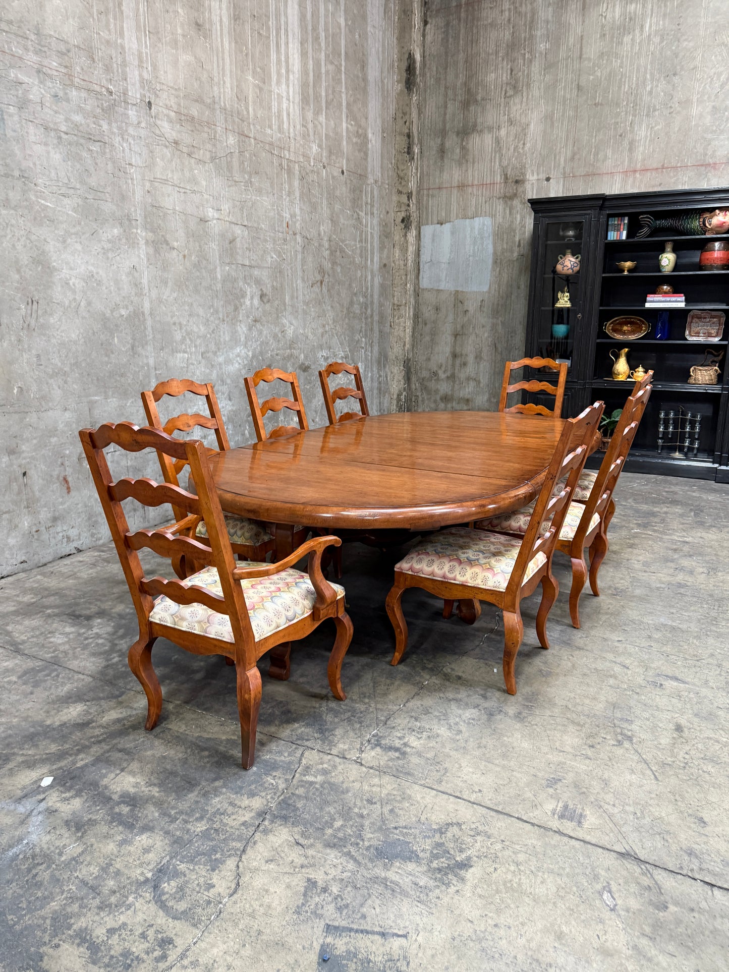 Custom Early Spanish Style Walnut Dining Table – Round to Oval with Leaves, Carved Stretcher Base, 107″L × 60″W × 30″H