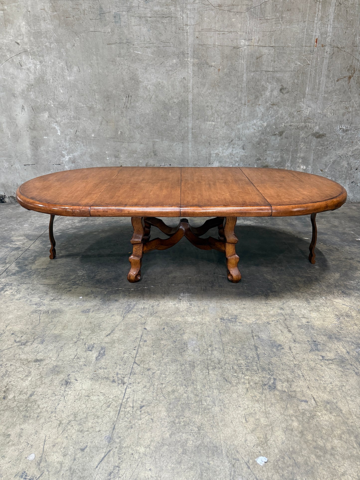 Custom Early Spanish Style Walnut Dining Table – Round to Oval with Leaves, Carved Stretcher Base, 107″L × 60″W × 30″H