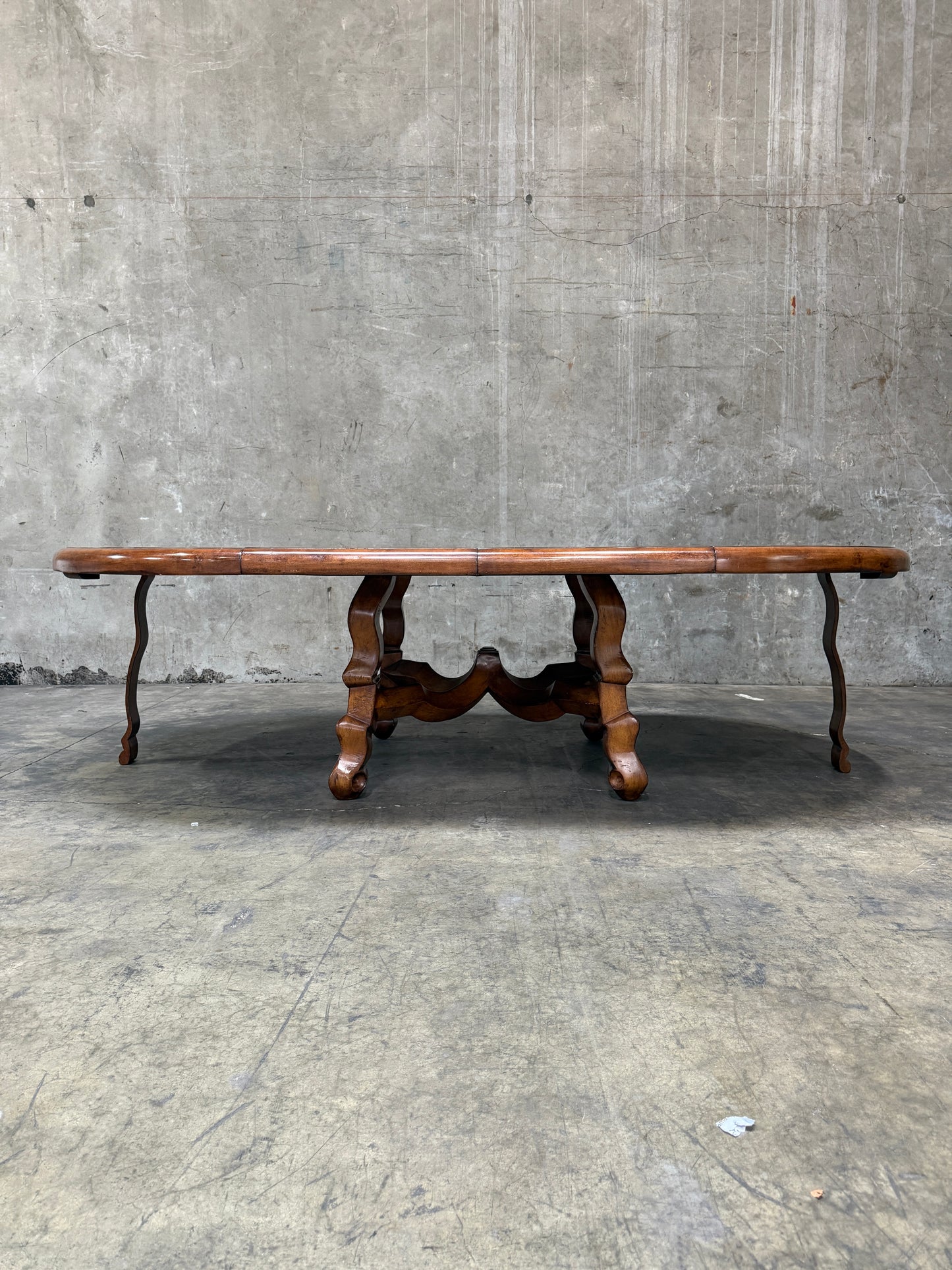 Custom Early Spanish Style Walnut Dining Table – Round to Oval with Leaves, Carved Stretcher Base, 107″L × 60″W × 30″H