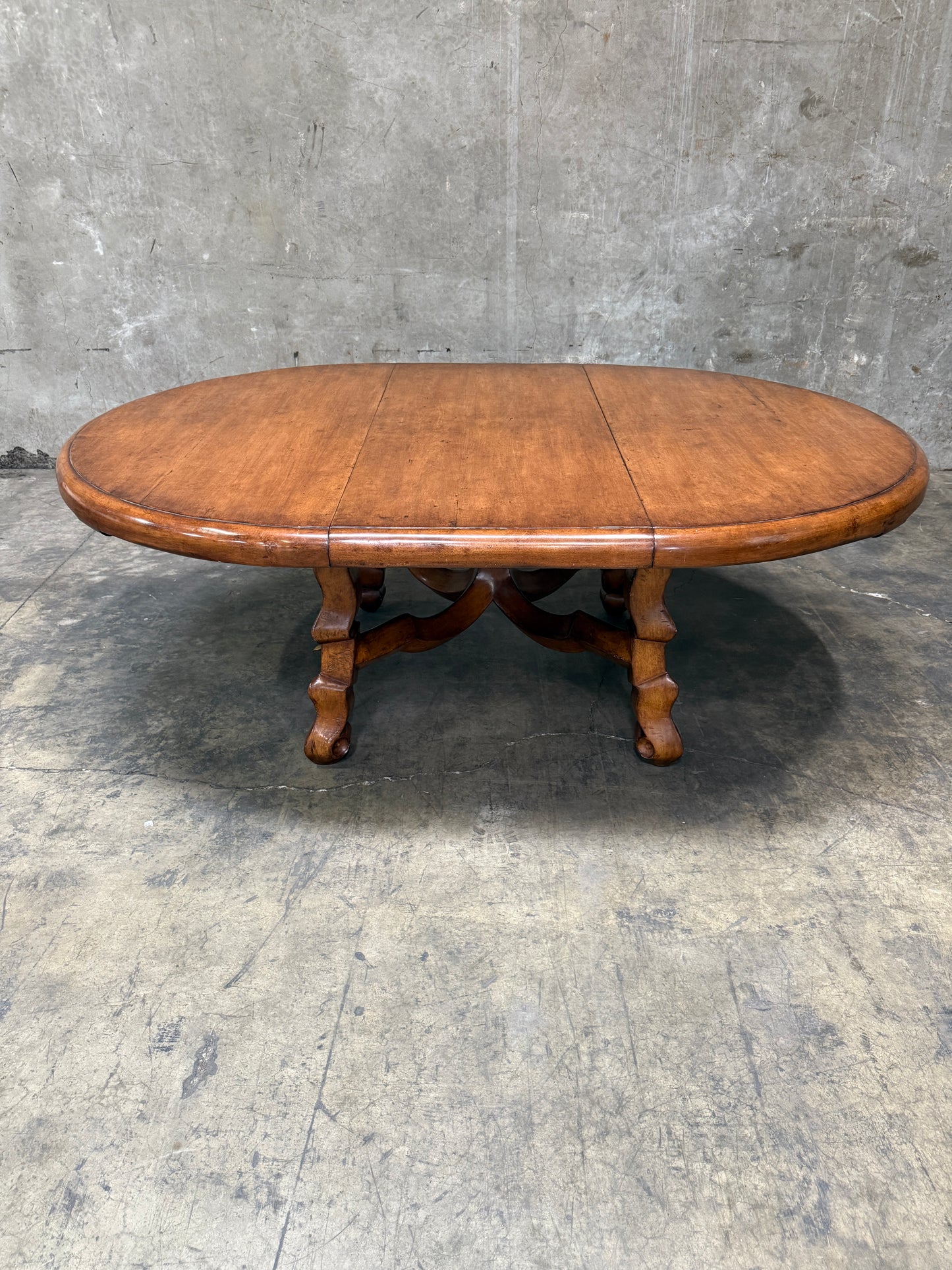 Custom Early Spanish Style Walnut Dining Table – Round to Oval with Leaves, Carved Stretcher Base, 107″L × 60″W × 30″H