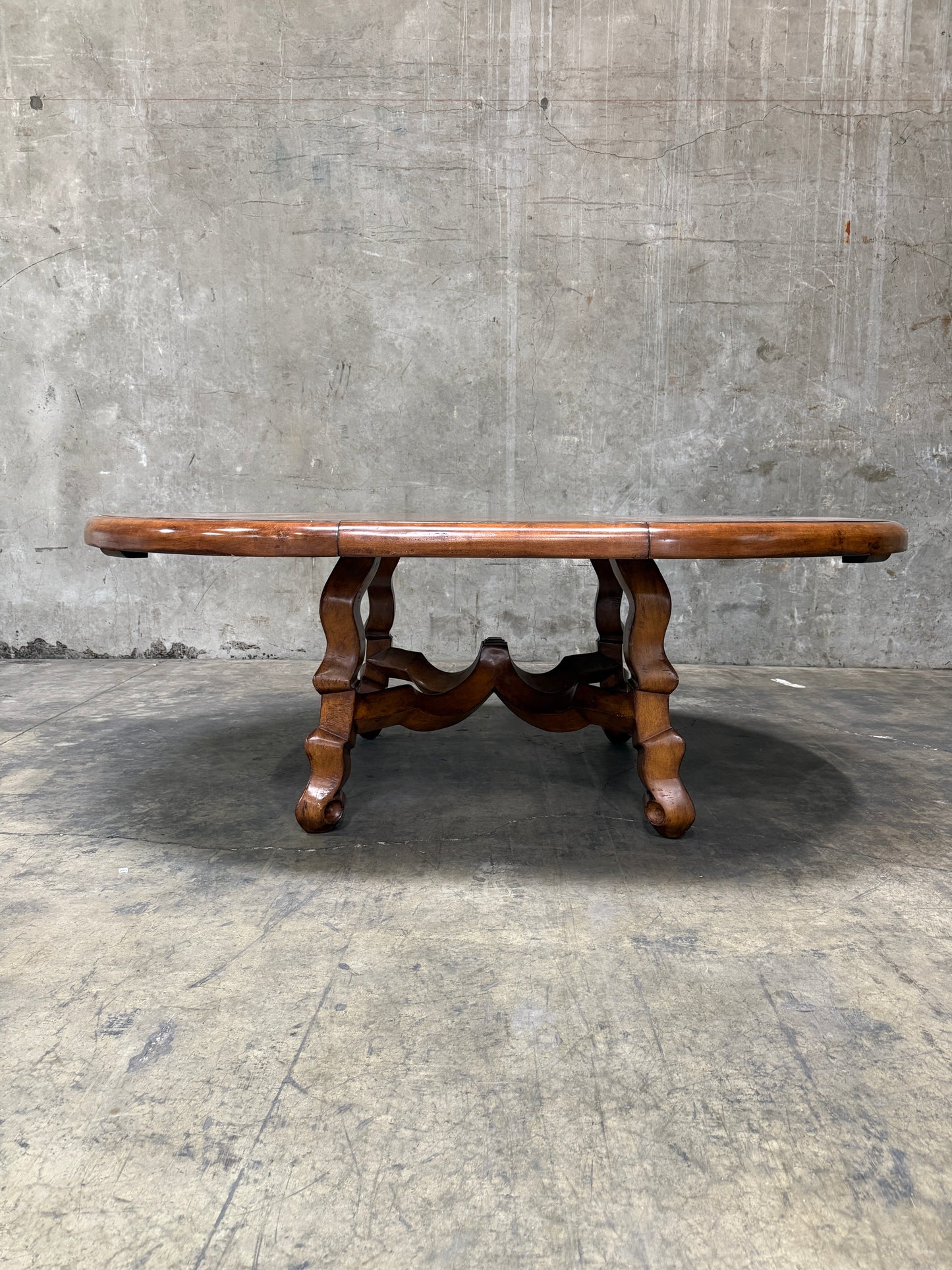 Custom Early Spanish Style Walnut Dining Table – Round to Oval with Leaves, Carved Stretcher Base, 107″L × 60″W × 30″H