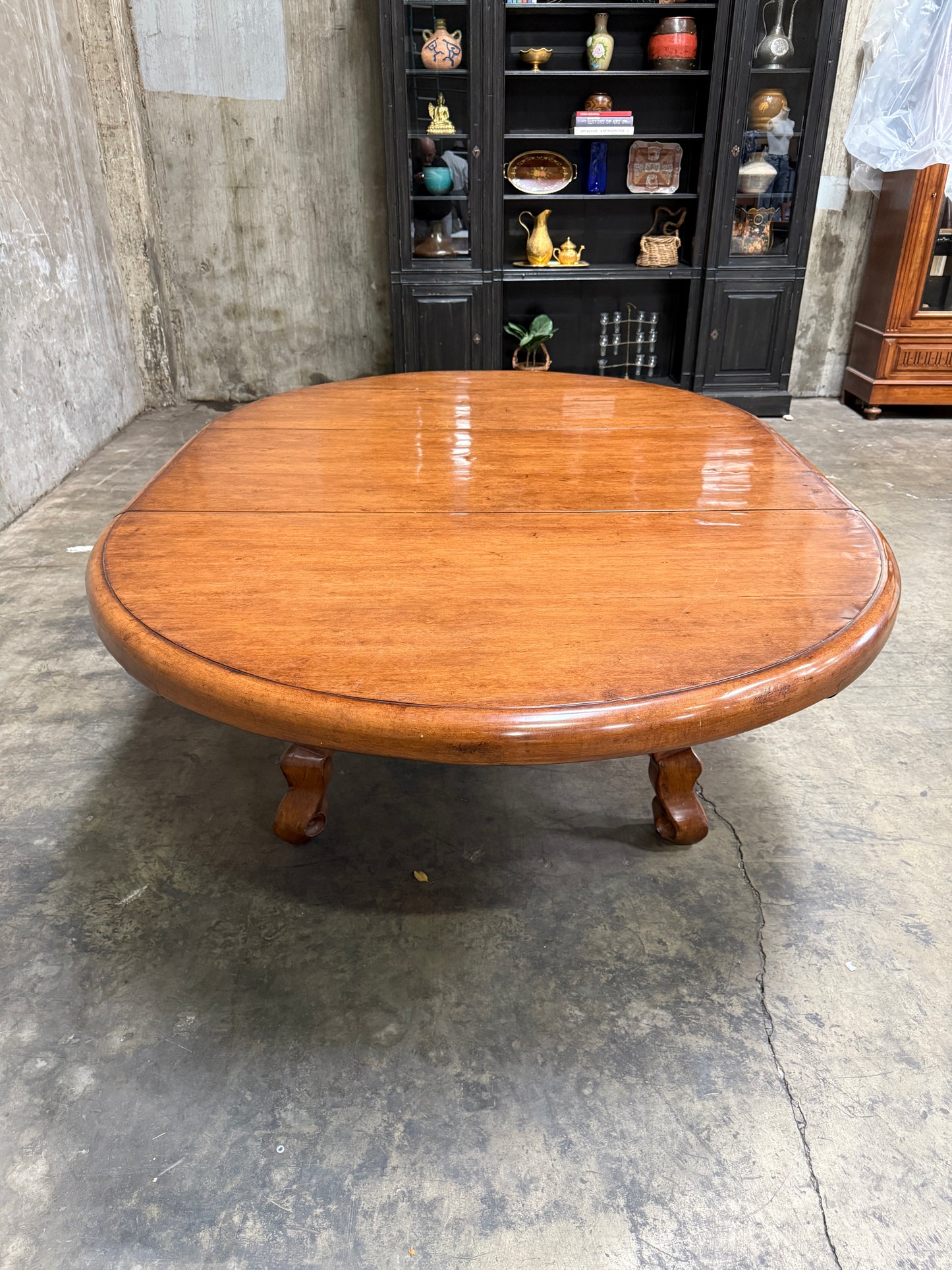Custom Early Spanish Style Walnut Dining Table – Round to Oval with Leaves, Carved Stretcher Base, 107″L × 60″W × 30″H