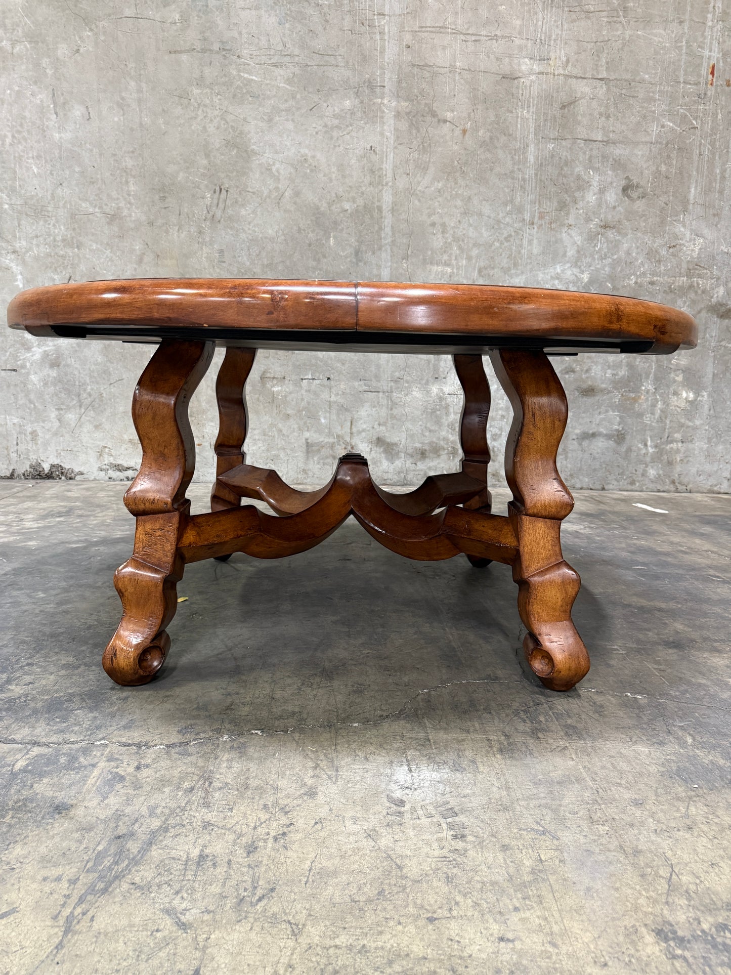 Custom Early Spanish Style Walnut Dining Table – Round to Oval with Leaves, Carved Stretcher Base, 107″L × 60″W × 30″H